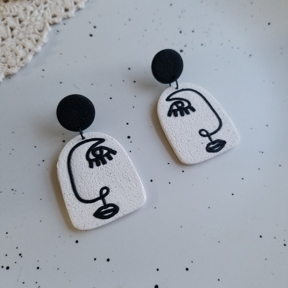 Black & white profile earrings
